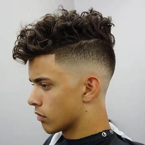 curly hair care tips young white male with a high razor fade