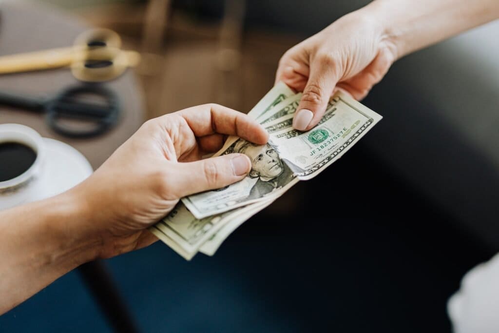 a hand holding money
